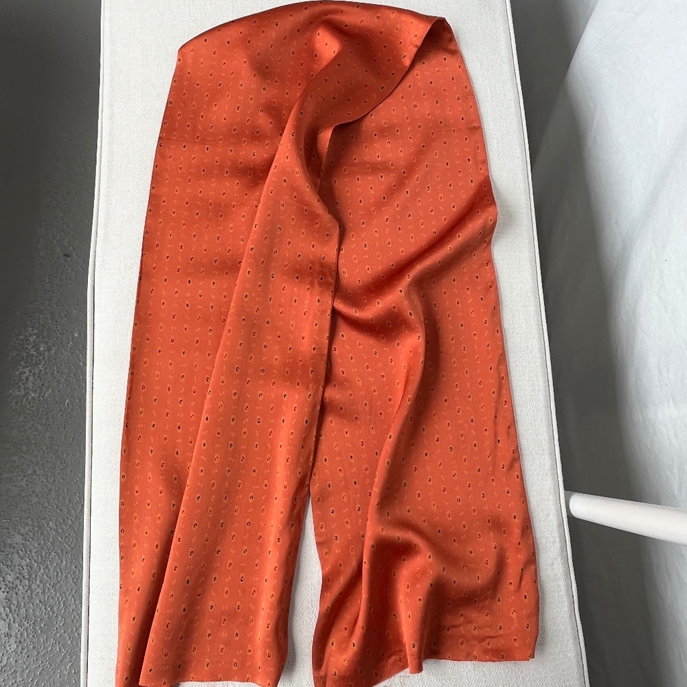 Silk charmeuse scarf fabric, side seams are sewn but bottom seams are raw,